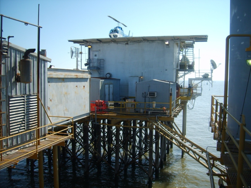 Offshore living quarters supported by timber pilings Offshore living quarters supported by timber pilings